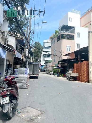 Nhà góc 5 tầng nở hậu L 12.4m mặt tiền Trần Bình Trọng P1Q10