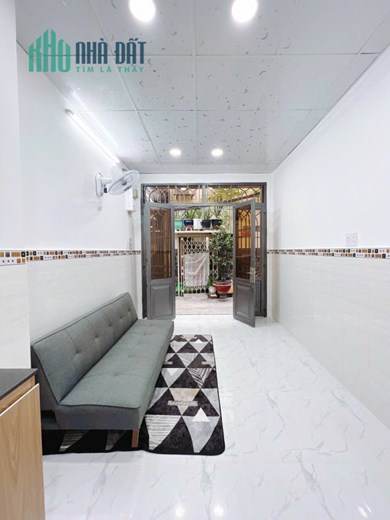 Nhà mới 2 tầng hẻm thông Bến Vân Đồn P6Q4 - Giá : 2.45 Tỷ