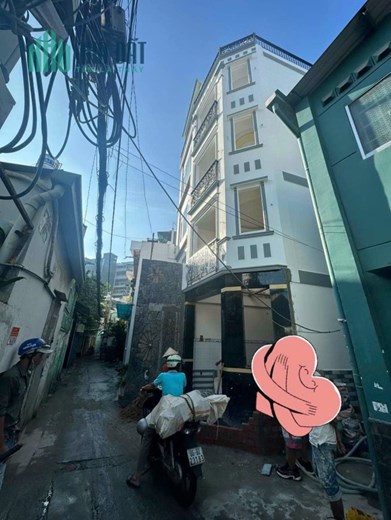 NHÀ BÁN.SIÊU PHẨM SÁT MẶT TIỀN 5 TẦNG - 5 PN - OTO ĐẬU CỬA HOÀN CÔNG ĐỦ.
